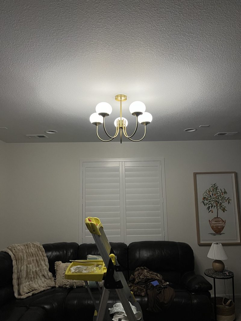 Ceiling light fixture installed over a living room