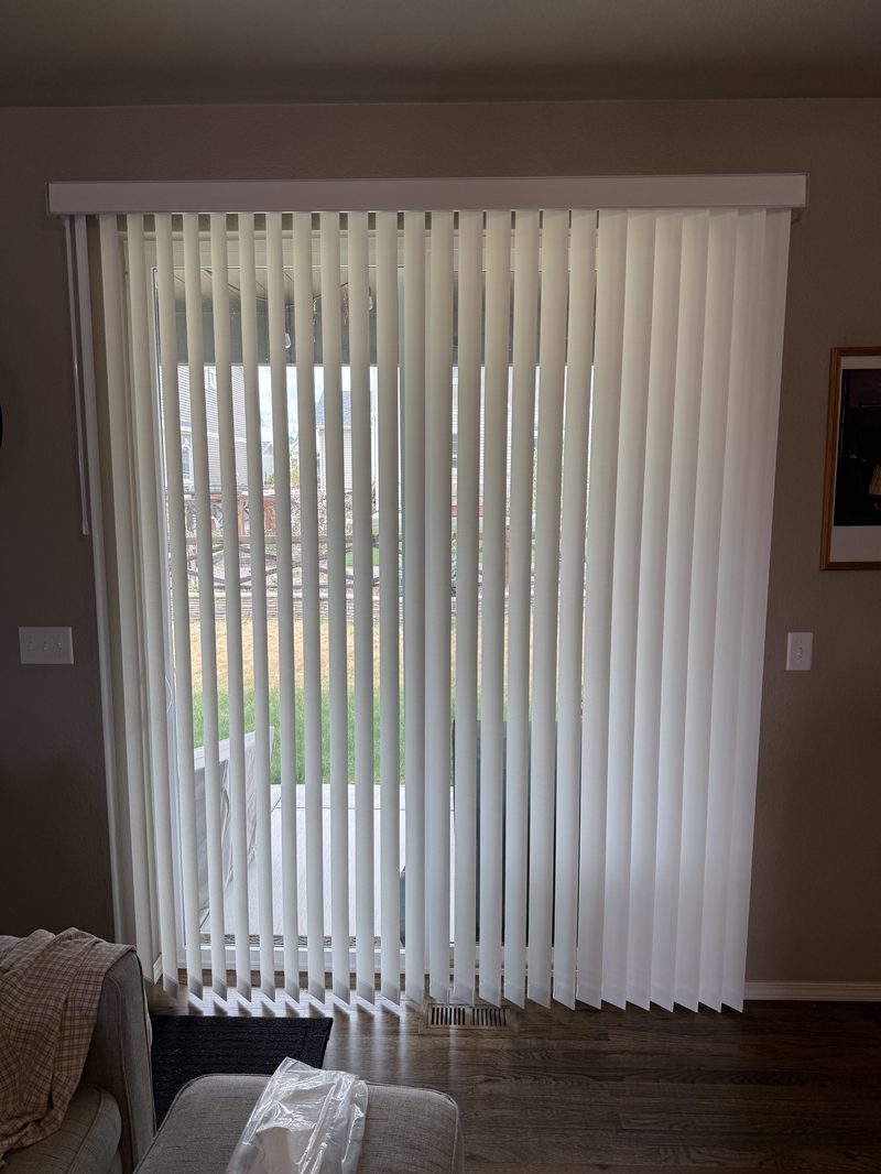 Vertical blinds installed on a patio slider door